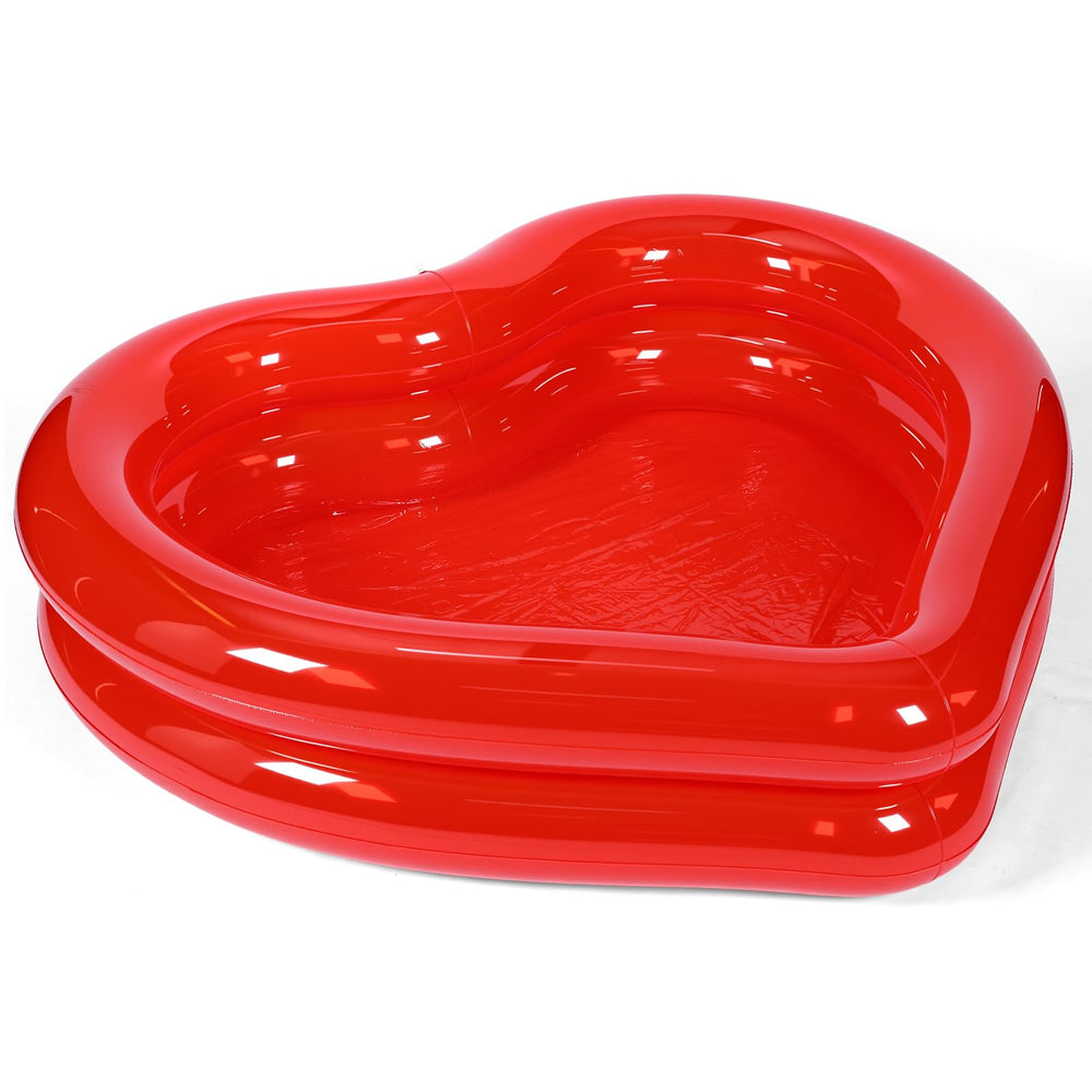 Skylety heart shaped pink pool adds romantic flair to backyard gatherings.