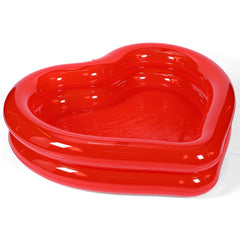 Skylety heart shaped pink pool adds romantic flair to backyard gatherings.