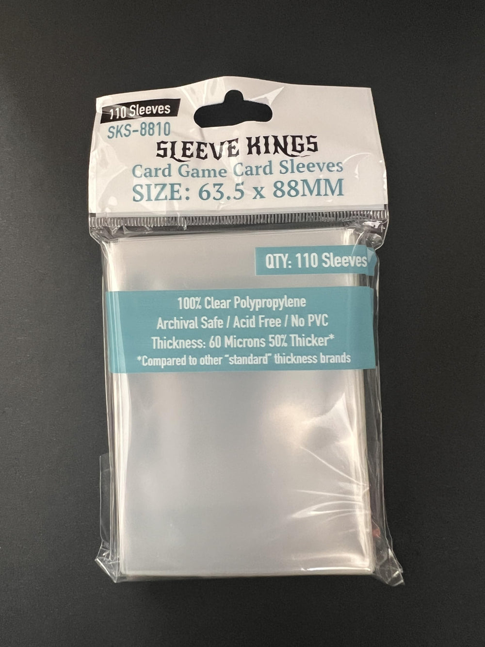 Sleeve Kings clear sleeves encasing a shuffled deck for durable protection.