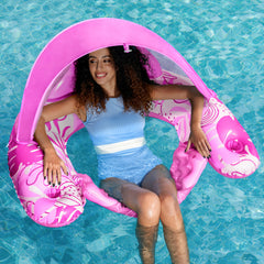 Sloosh pool floats with canopy pink provides shade for relaxed outdoor lounging.