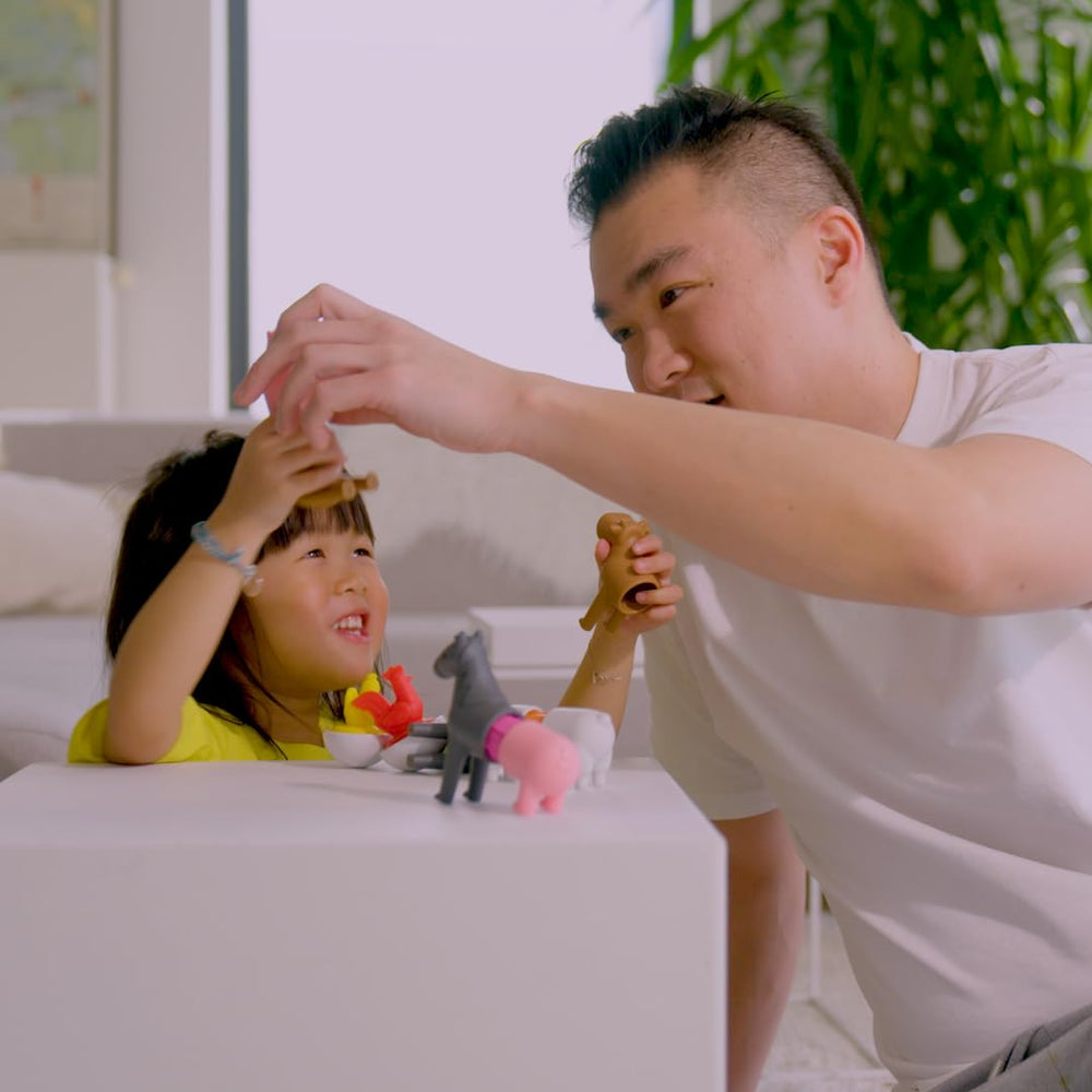 Child playing with SmartMax Farm Animals set, open-ended play and quick setup.