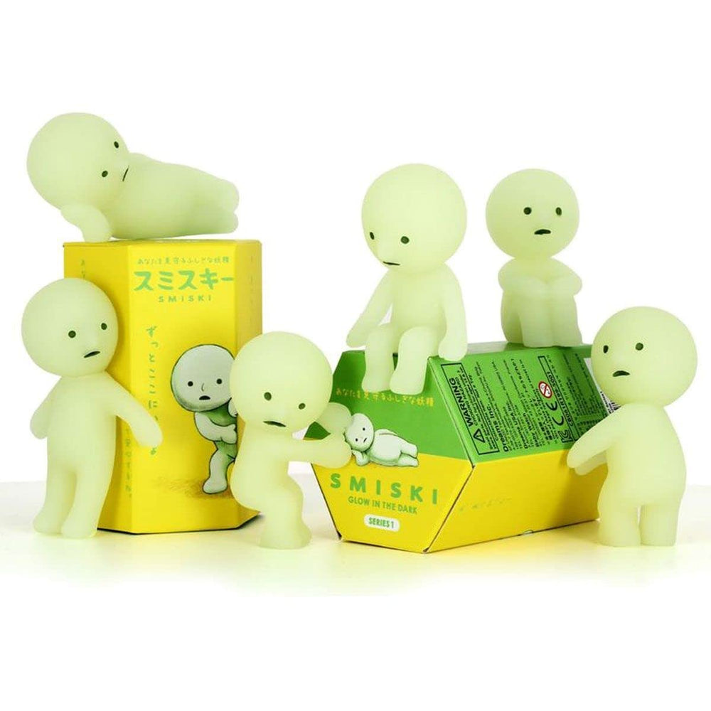 Smiski Series 1 sealed blind box figure glowing softly in the dark
