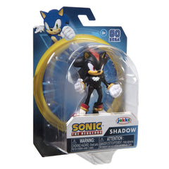 Shadow figure being gently adjusted for a new pose during play.