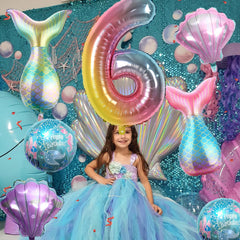 Sowide round mermaid balloons 18-inch brighten the underwater backdrop.