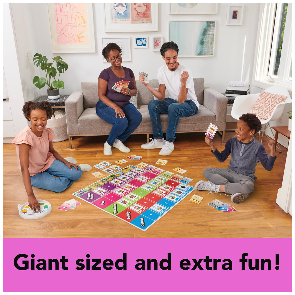 Spin Master Games The Game of Life Giant Edition family play photo showing 2-4 players.