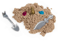 Spin Master Kinetic Sand treasure piece hides a reward to uncover during play.