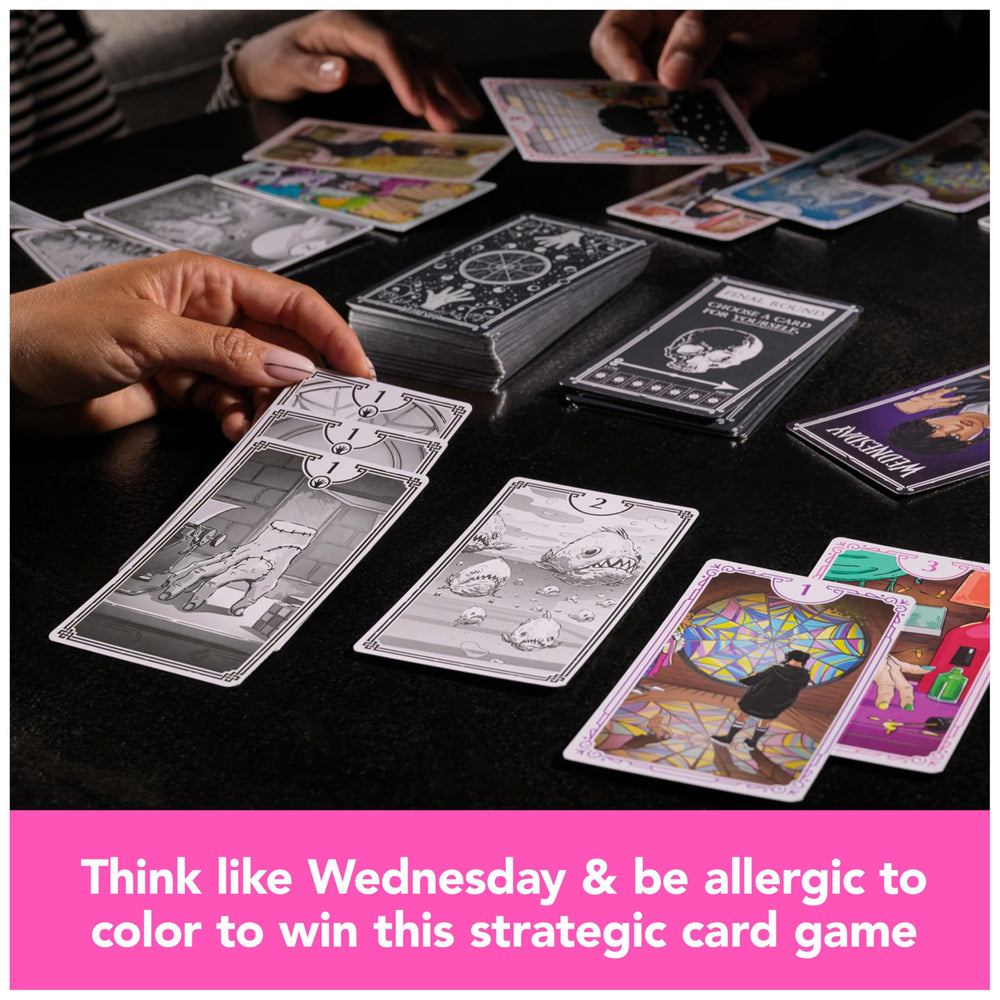 Spin Master Wednesday card game setup showing black and white cards for strategy.