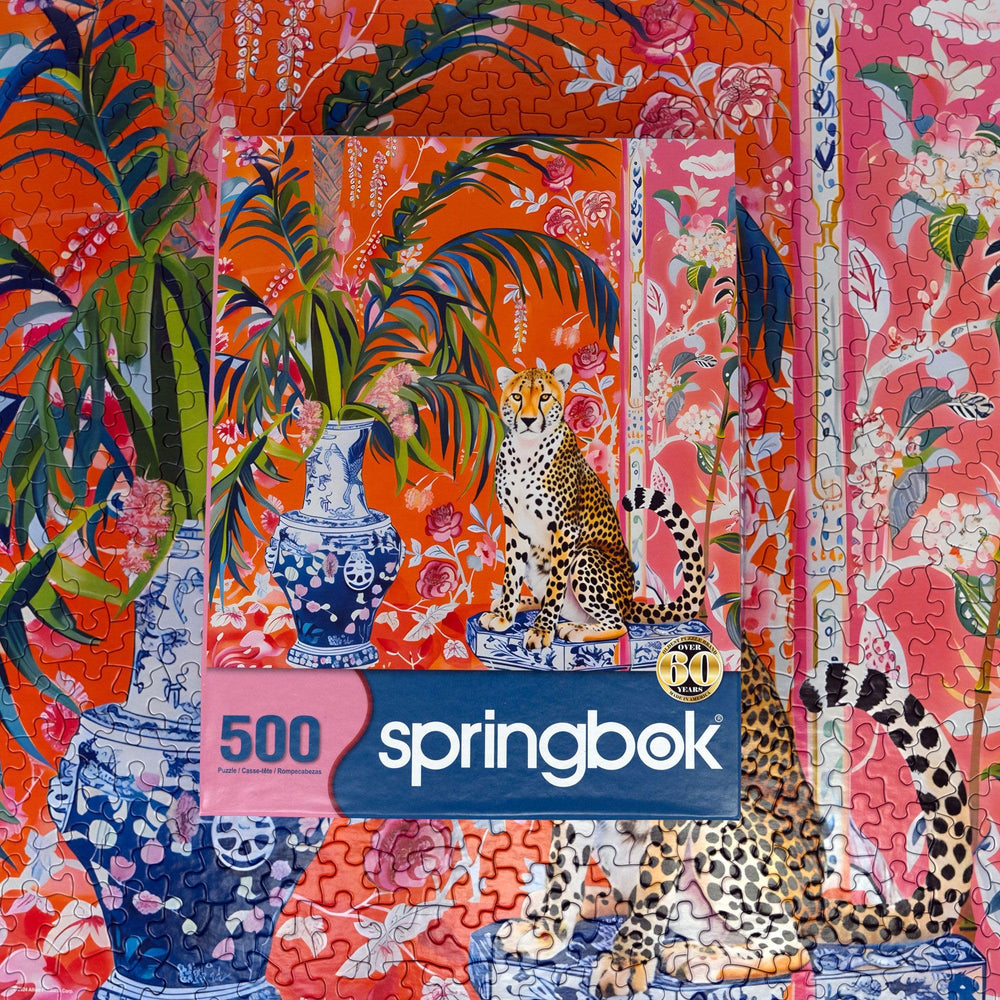 Springbok ginger jar vases add elegance to the cheetah artwork.