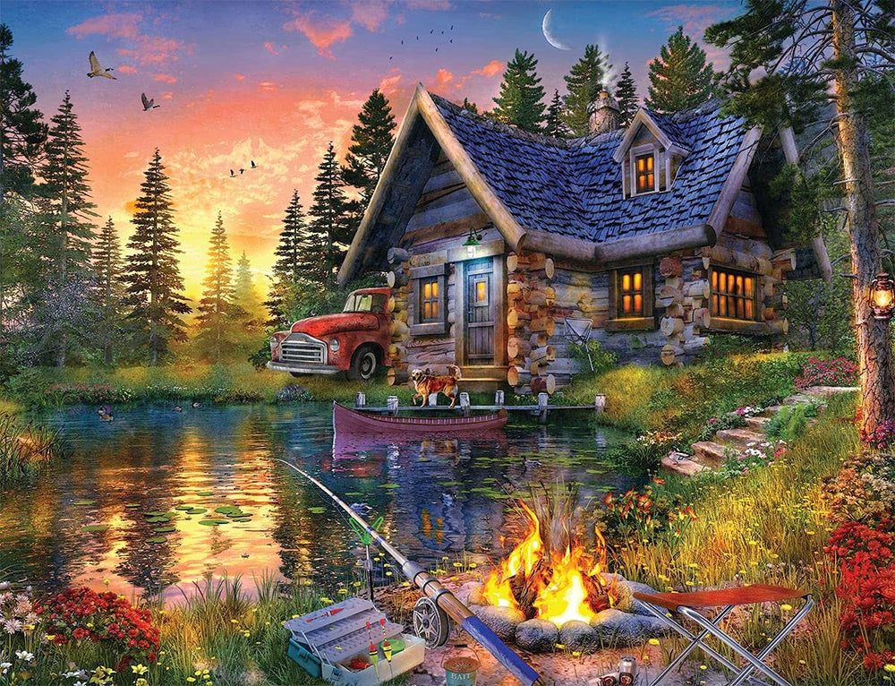 Springbok Sun Kissed Cabin puzzle shows lake view with sunset hues for a relaxing family activity.