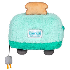 Squishable toaster plush resting on a desk, inviting snuggles and play