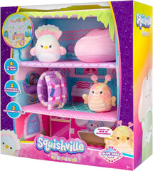 Squishville Blue Seas Inn suitcase with Balia the butterfly for portable pretend travel.