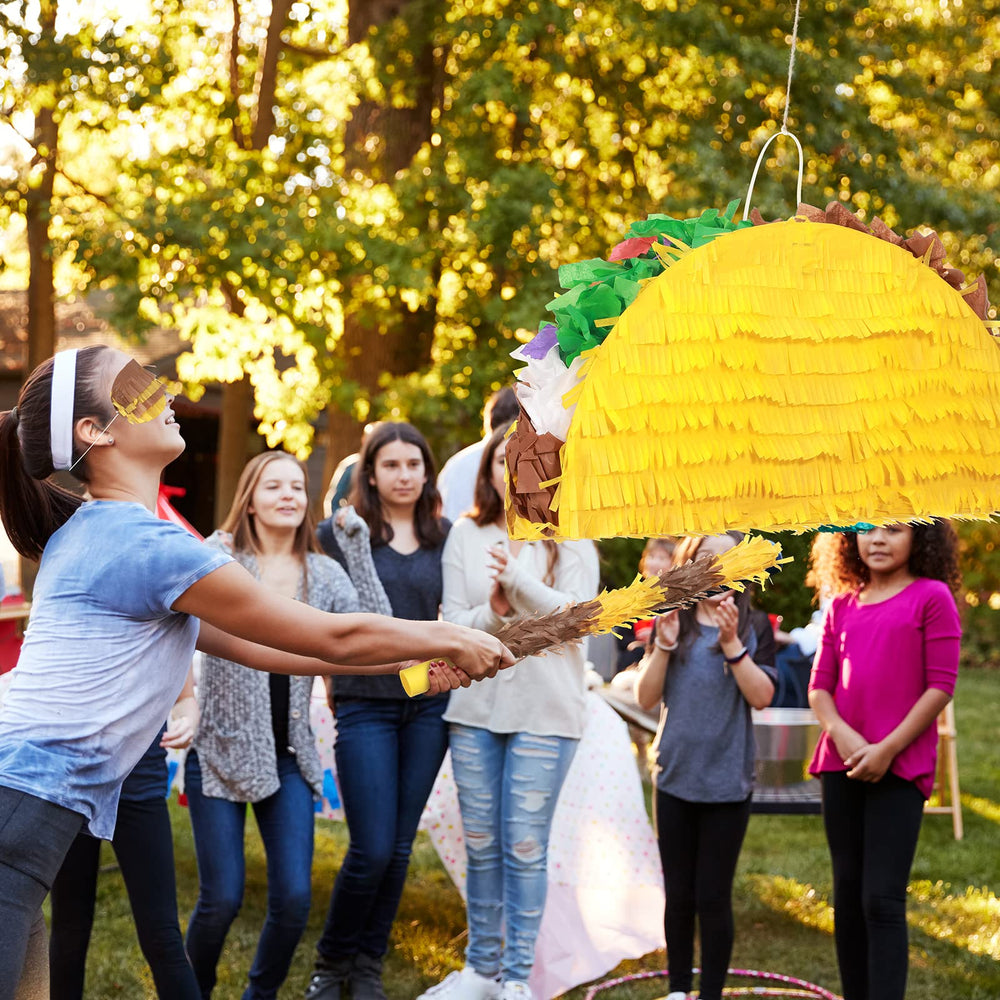 Sratte taco pinata eye mask included for fun party activities and photos.