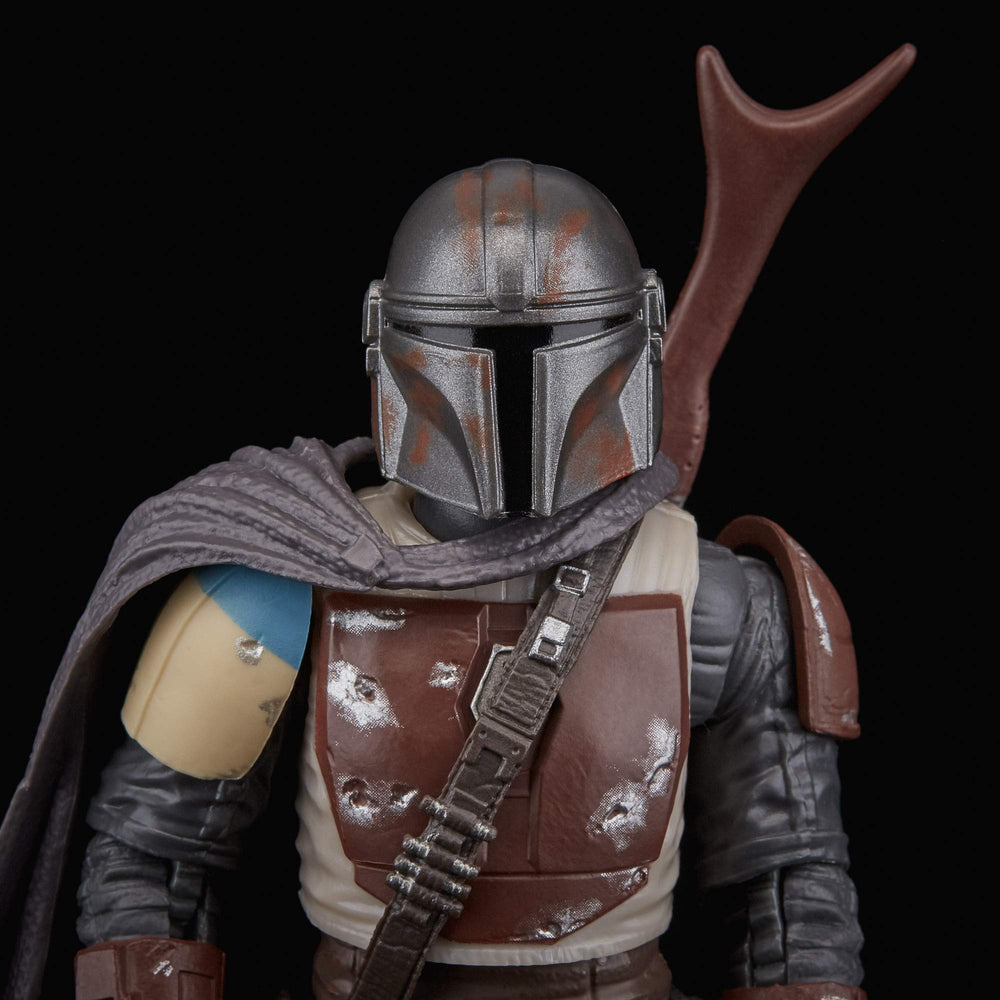 T-visor mask close-up emphasizes iconic helmet design and mystery.