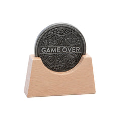 Stellar Factory Game Over Coin with wooden display stand for a desk display.