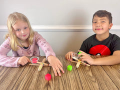 STEM Inventions Catapult Kit launch trajectory demo supports energy learning.