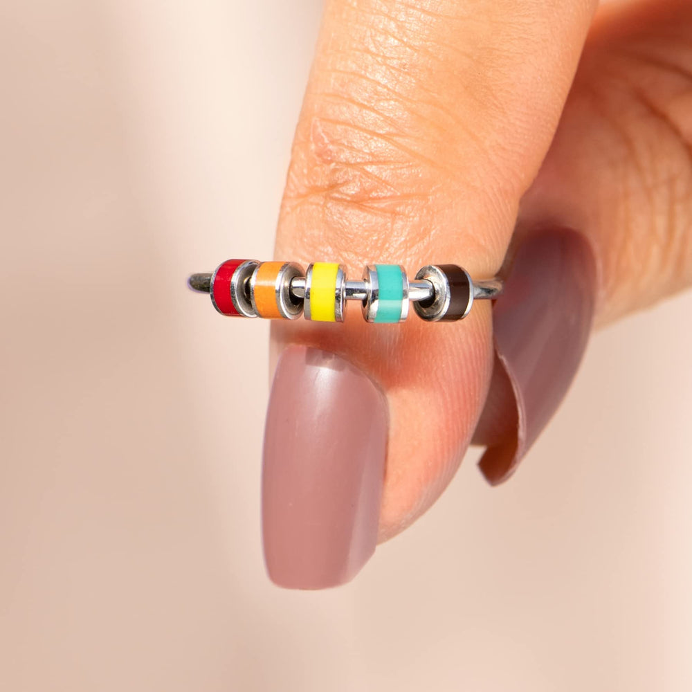 StoryJewellery Spinner Ring on finger demonstrating smooth rotation.