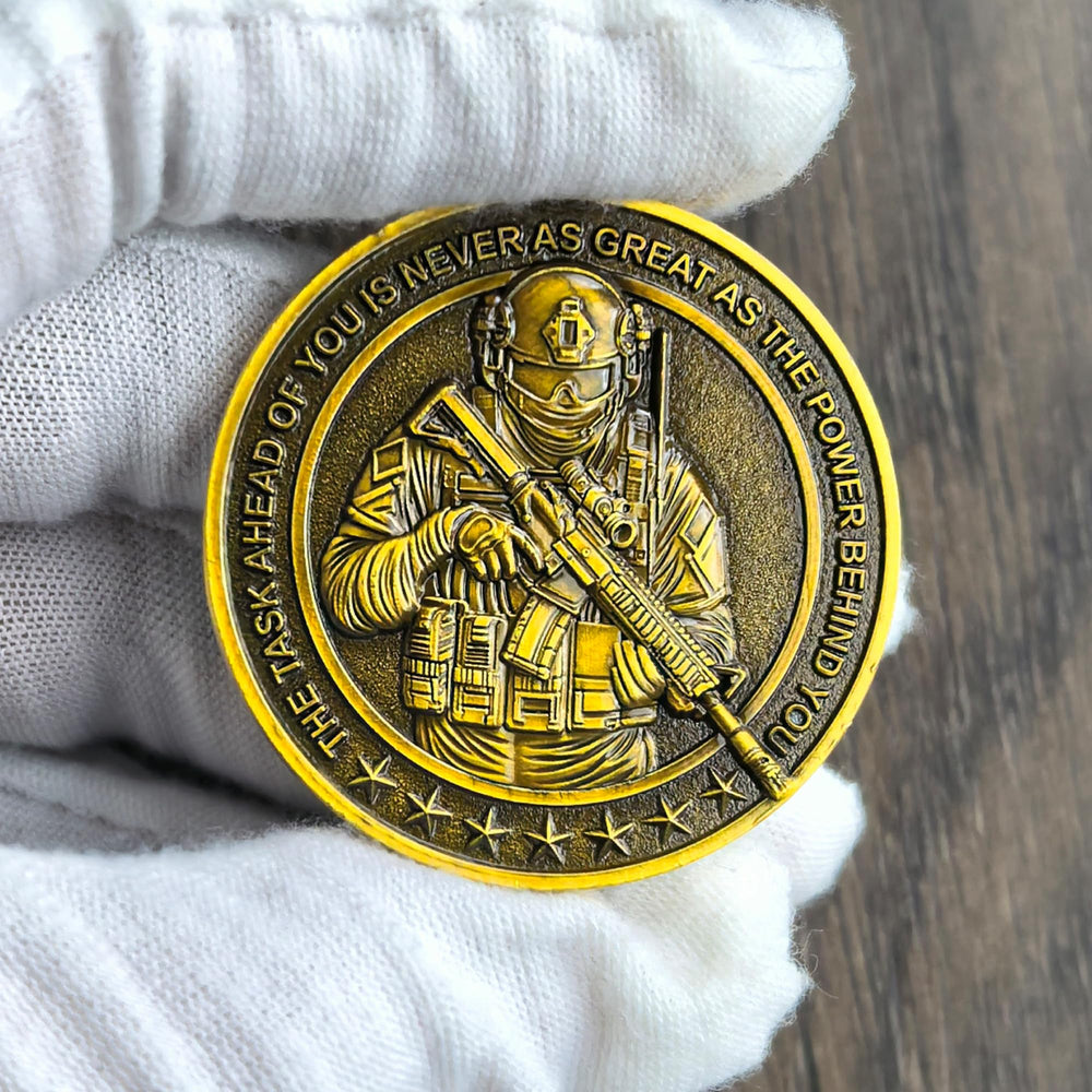 Strugglejewelry coin in hand to illustrate portable size