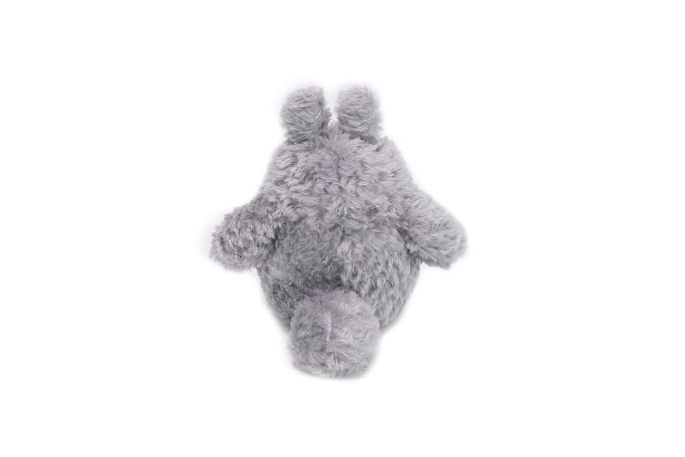 Studio Ghibli Totoro plush display on shelf adds whimsical charm.