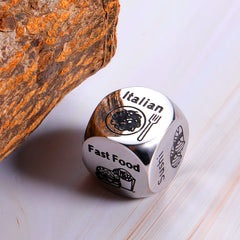 STUNFASSOO durable steel dice resting on tablet, promising long-lasting date night fun