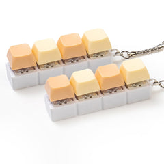 Sumgsn creamy keyboard fidget 2-pack on a clean desk for portable stress relief.