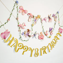 SunBeauty fairy garden garland banner 3m creates a whimsical backdrop for parties.