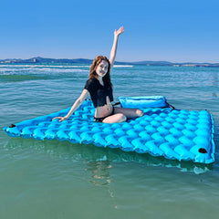 Sunrio giant floating mat blue provides stable lounging surface on water.