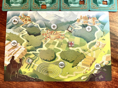Suspect tiles arranged on the table for interactive deduction in Kronologic.