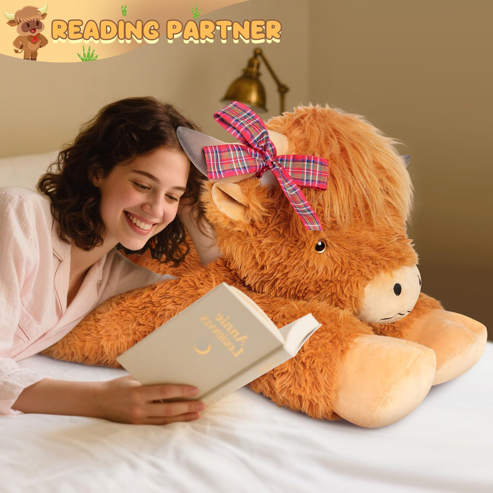 SuzziPals Highland Cow plush on a bed adds playful charm to a nursery