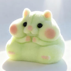 Taba squishy hamster toy side view shows fluffy fur and compact fidgeting potential.