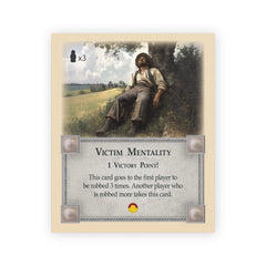 Tabletop Monthly Victim Mentality Card front view, compatible with Catan components for seamless play.