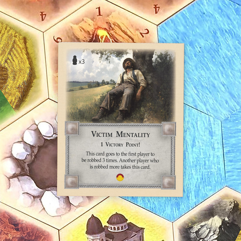 Tabletop Monthly Victim Mentality Card in-use, easy integration with Catan components.