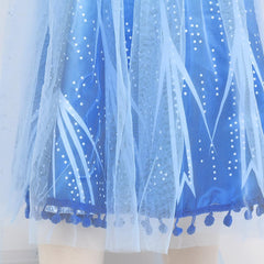 Tacobear dress hem pom-poms create playful movement during dances.