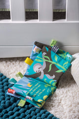 Taggies hook-and-loop closure keeps pages secure for little hands.