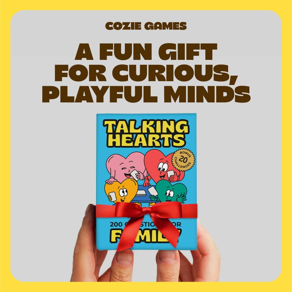 Hands holding Talking Hearts cards ready for a cozy chat.
