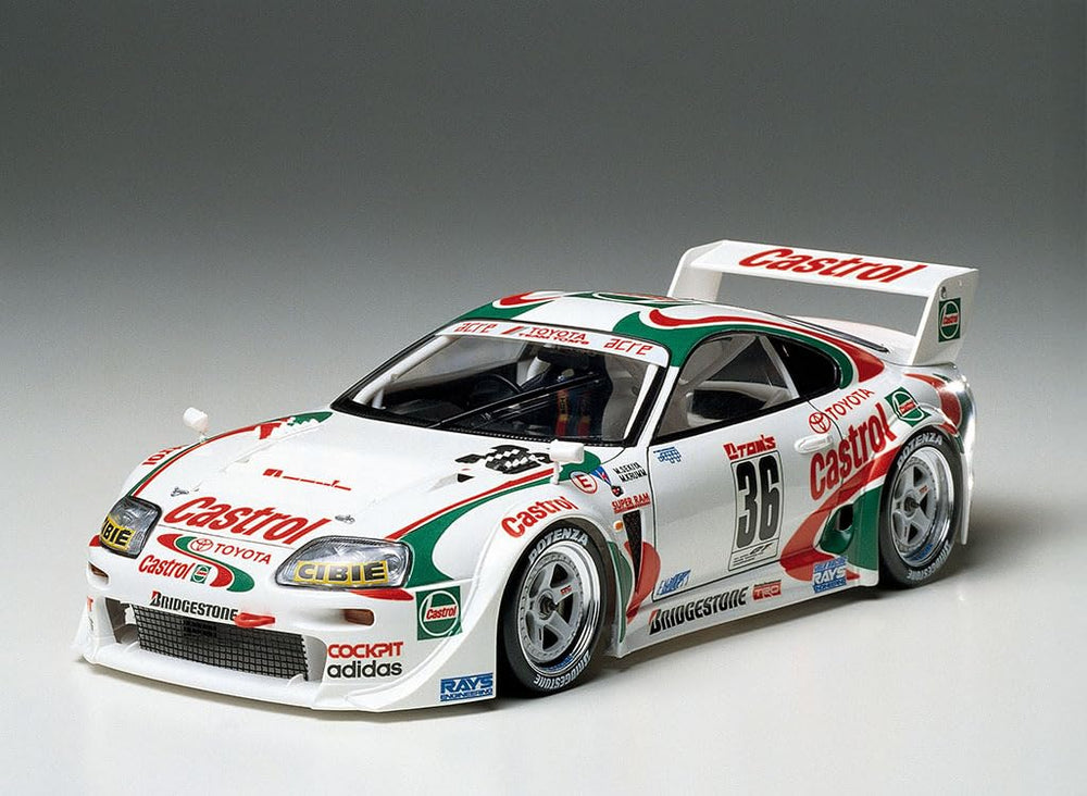 Tamiya 1/24 Castrol Toyota Tom's Supra GT in-display stand showing ready exhibit display.