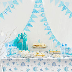 Tatuo large 8-foot tablecloth framed by blue snowflakes for gatherings.