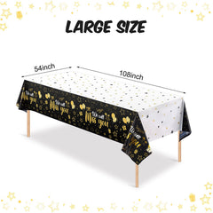 Close-up of the gold star print on the Tatuo tablecloth for party vibe.
