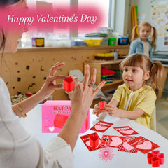 TATWOQ valentines day party favors featuring heart coils.