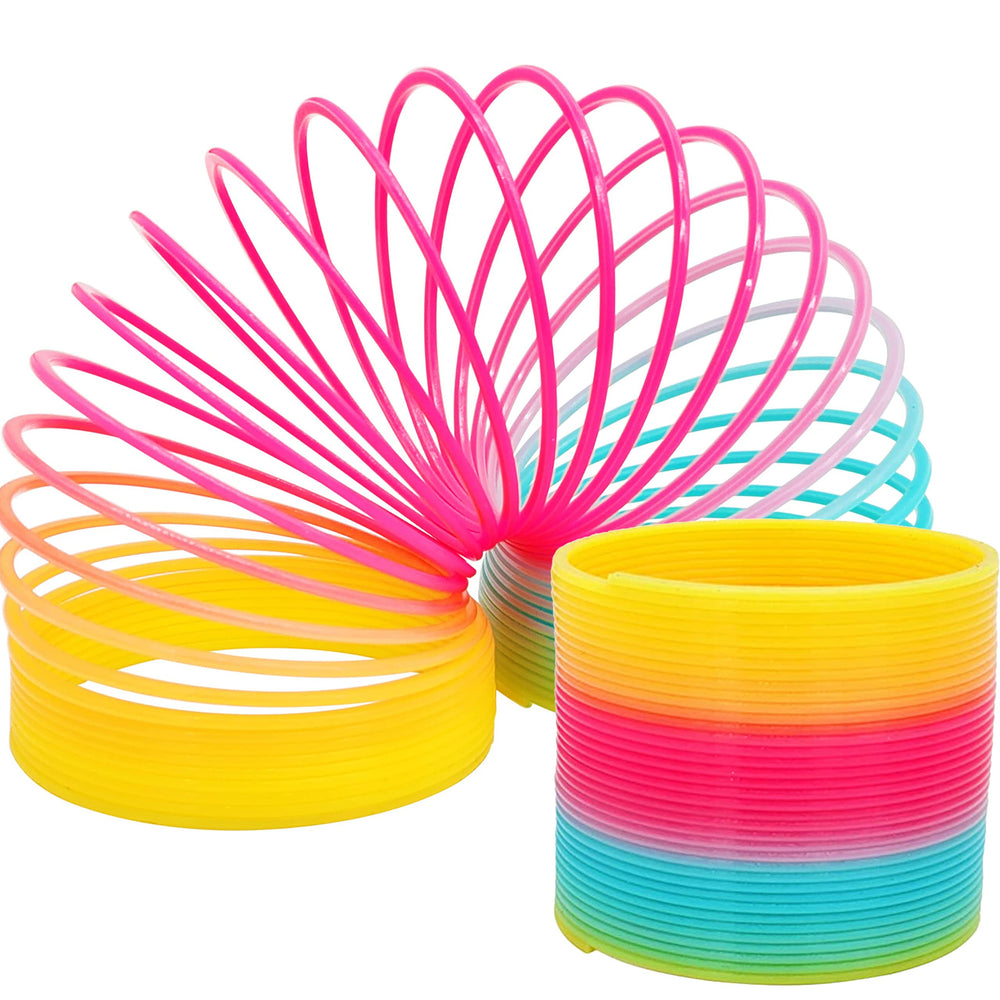 The Dreidel Company multicolor coil spring shown with carnival prizes and party booths.