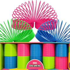 The Dreidel Company neon coil springs arranged as party favors on a kids' party table for play.