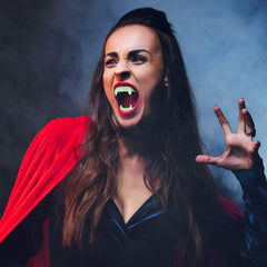 The Dreidel Company Neon Fangs Teeth pack 2 displayed for party pranks