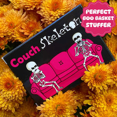 The Dusty Tophat Couch Skeletons gift-ready packaging with a spooky vibe.