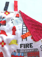 The Learning Lovey firefighter secure clip for stroller or car seat attachment.