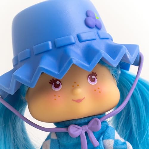 The Loyal Subjects Blueberry Muffin Fashion Doll features interchangeable outfits for endless mix-and-match fashion.