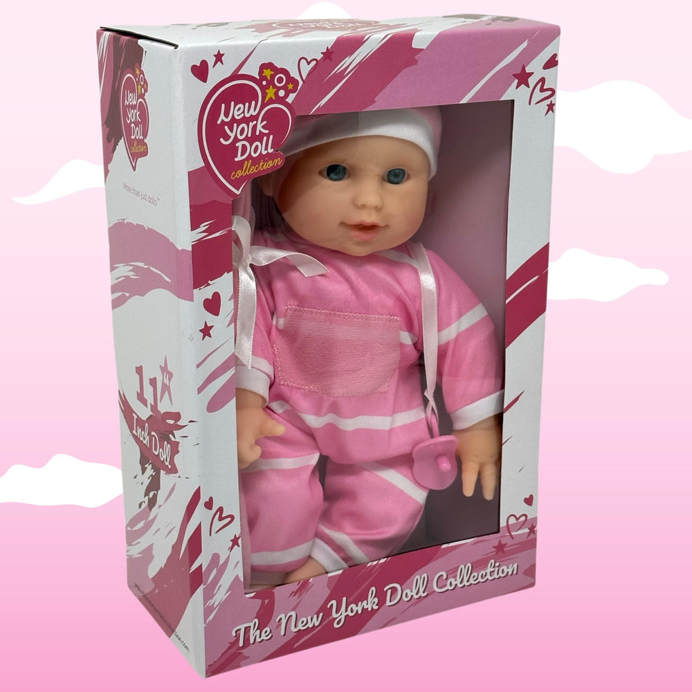 Cute matching hat and outfit detail on The New York Doll Collection 11in baby doll.