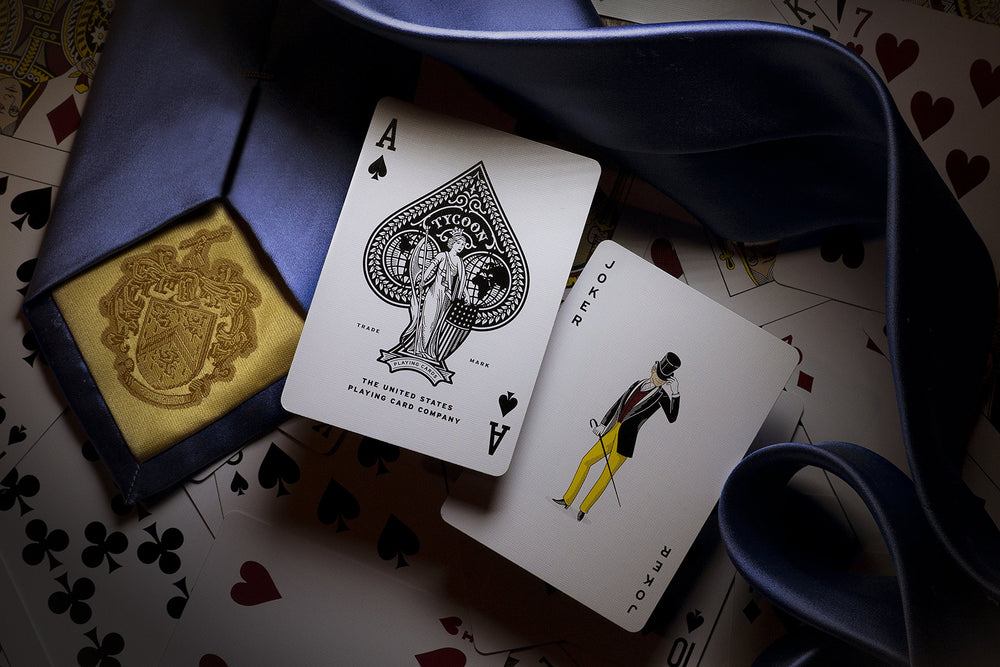Theory11 Tycoon Blue court cards licensed from Fournier enhance authentic aesthetics.