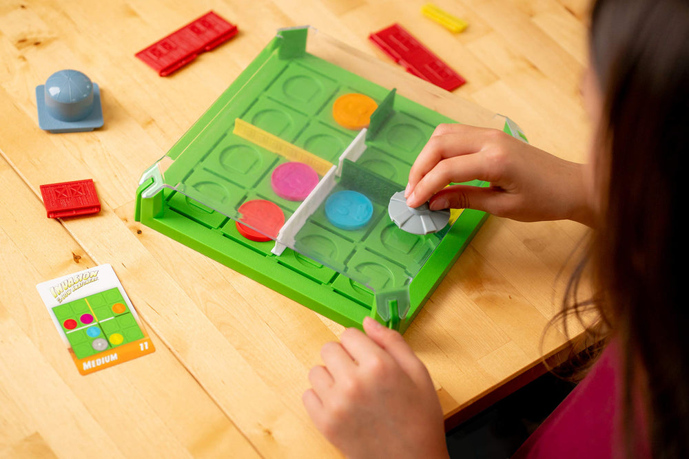 ThinkFun Invasion of the Cow Snatchers magnetic tokens used for puzzle strategy.