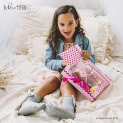 Tickle & Main big sister moment captures emotion for family photos.