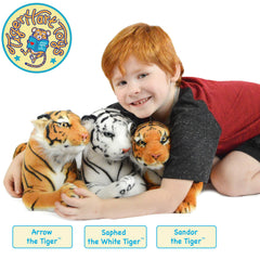 TigerHart Arrow plush on a bed as a cozy display companion.