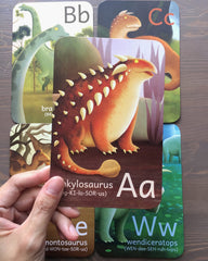 Tiny Worlds Giganotosaurus card invites exploration while reinforcing alphabet order.